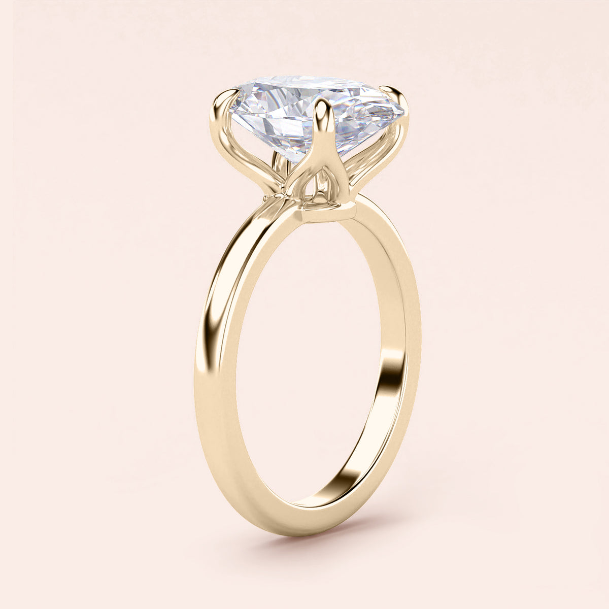 Elegant 14K yellow gold engagement ring with a marquise-shaped diamond in a tulip mount and plain band.