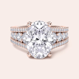 Exquisite 14K/18K rose gold oval diamond engagement ring with hidden halo accents and triple band setting.