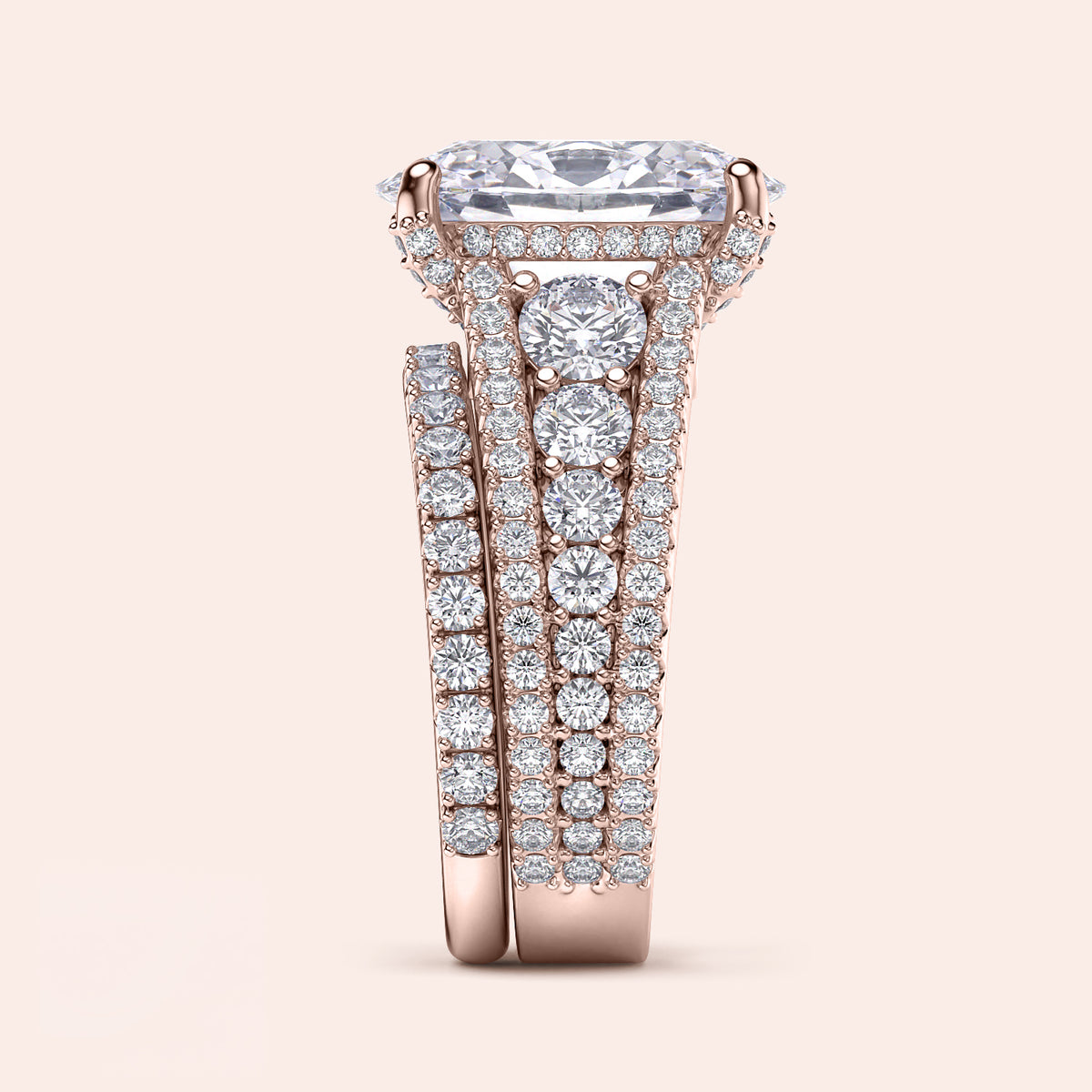Luxurious 14K rose gold engagement ring set featuring an emerald cut diamond, adorned with round brilliant diamonds on a triple row shank.