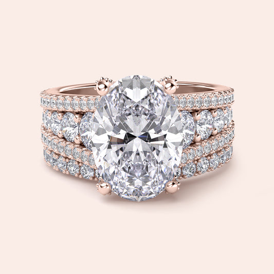 Elegant rose gold women's ring featuring a large oval diamond with halo accents and three rows of smaller diamonds. Available in 14K, 18K.