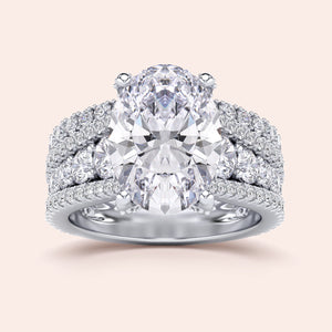 Stunning 14K/18K white gold or platinum oval diamond engagement ring with three-row band and sparkling accents.