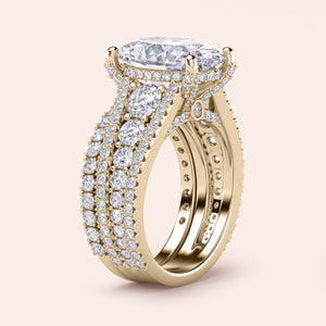 Stunning 14K Yellow Gold engagement ring with oval diamond center, halo accents, and three-row band design. Not worn on model.