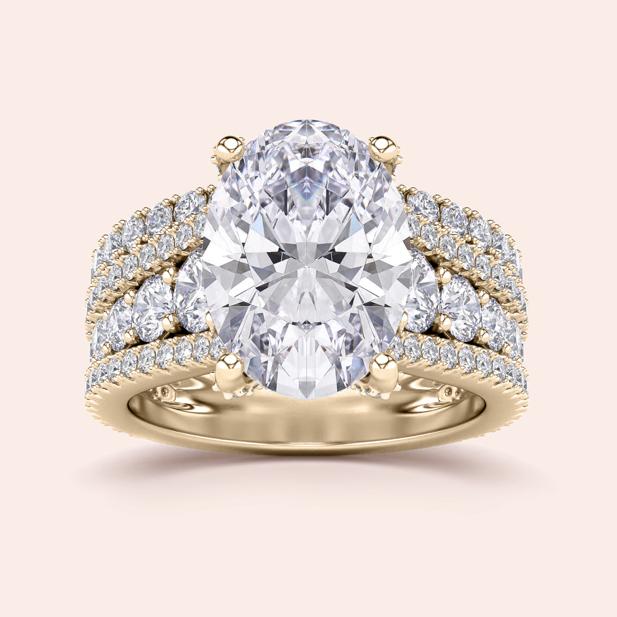 Luxury engagement ring in 14K or 18K gold featuring an oval-cut diamond withPave accents and a three-row band design.