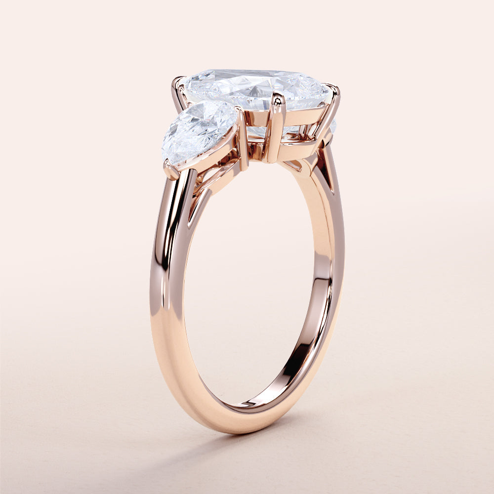 Elegant 14K Rose Gold Engagement Ring with Marquise Diamond Centerpiece and Side Stones, Worn for Style Showcase.