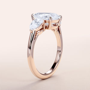 Elegant 14K Rose Gold Engagement Ring with Marquise Diamond Centerpiece and Side Stones, Worn for Style Showcase.