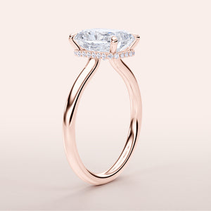 Elegant marquise-shaped diamond engagement ring with a rose gold band, set in 14K, 18K, or platinum with a dazzling halo.