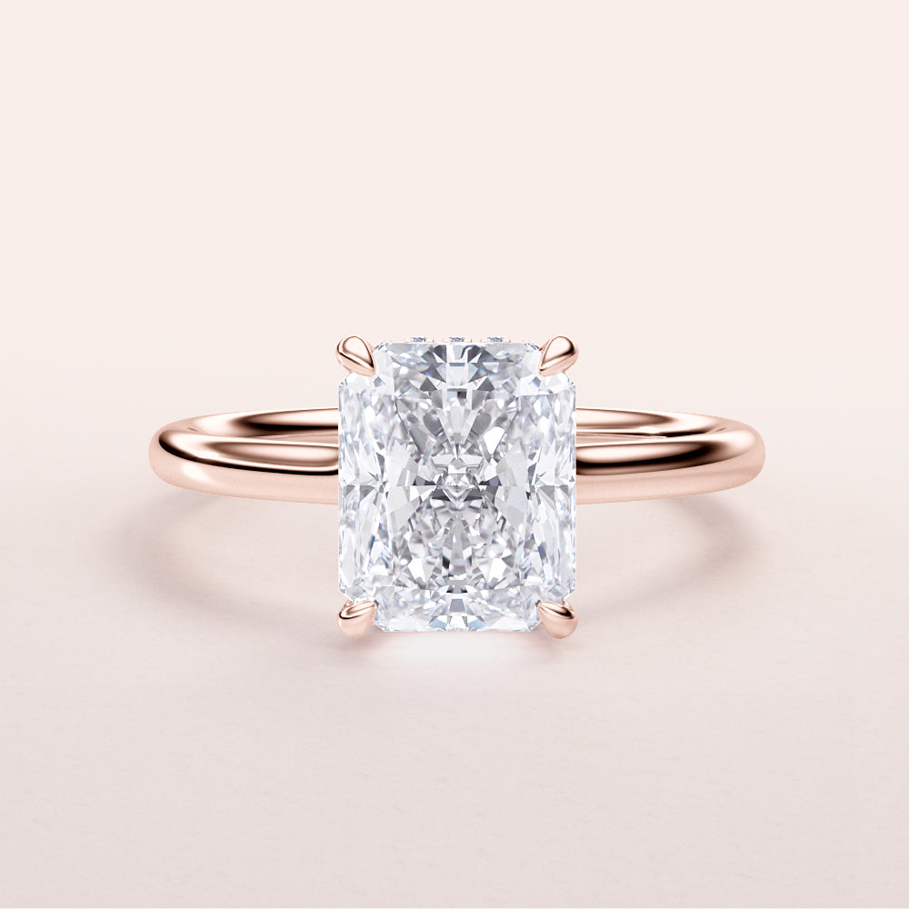 Radiant cut diamond engagement ring in rose gold band, available in 14K, 18K, or platinum. Elegant solitaire, sparkling design.|







#14KRecycledRoseGold
#18KRecycledRoseGold


