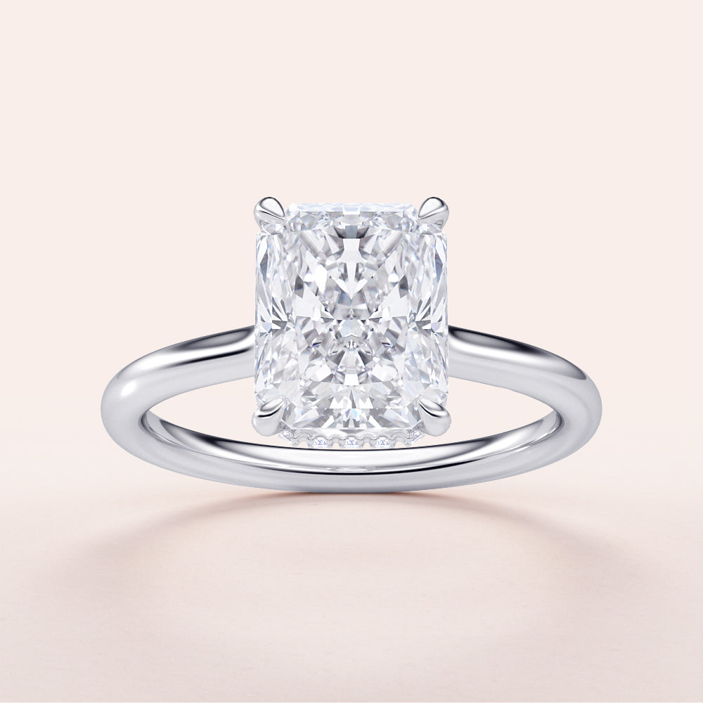 Radiant cut diamond engagement ring in 14K or 18K gold, featuring a sleek band and hidden halo design.|

#14KRecycledWhiteGold
#18KRecycledWhiteGold








#Platinum
