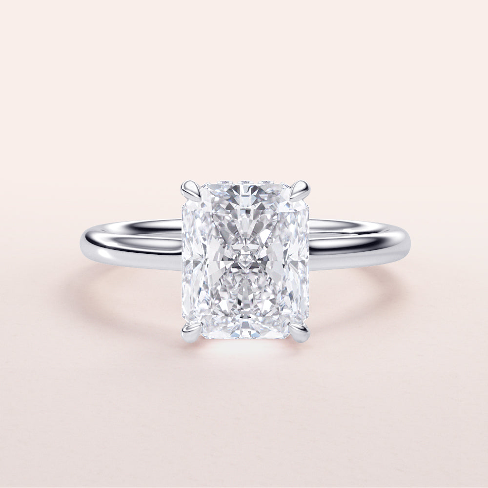 Radiant cut diamond solitaire ring on a sleek 14K white gold band, showcasing timeless elegance and sophisticated beauty.|

#14KRecycledWhiteGold
#18KRecycledWhiteGold








#Platinum