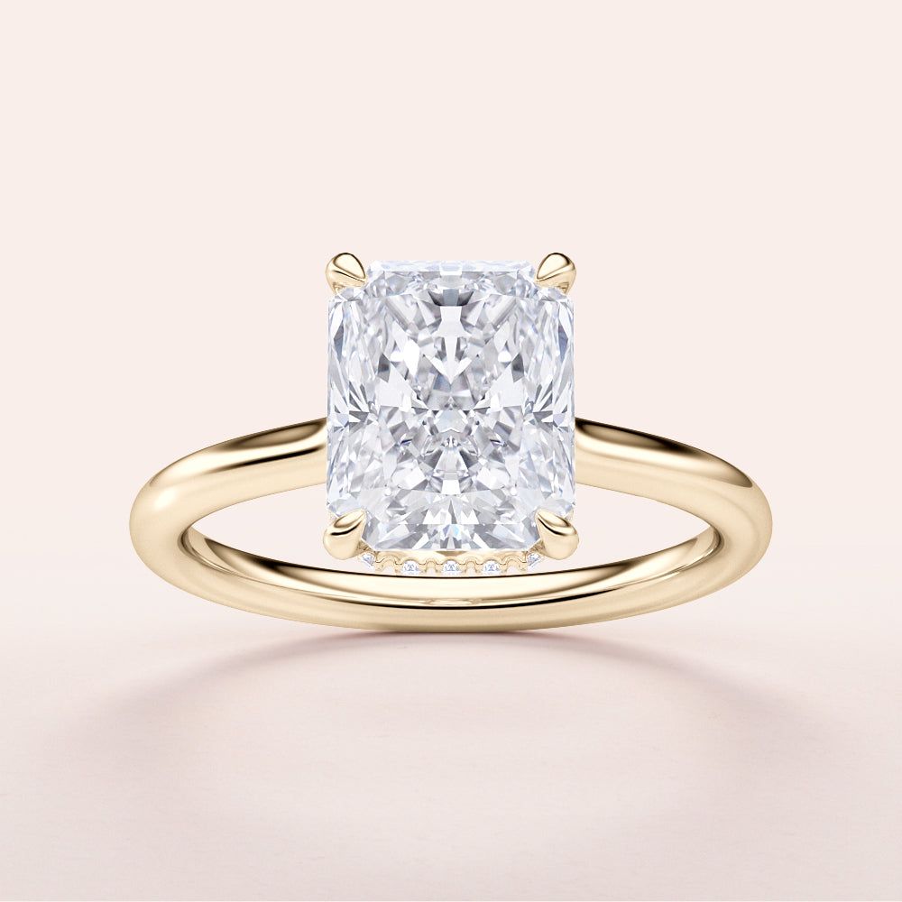 Radiant cut diamond solitaire ring in 14K yellow gold, featuring a hidden halo and an elegant plain band design.|




#14KRecycledYellowGold
#18KRecycledYellowGold





