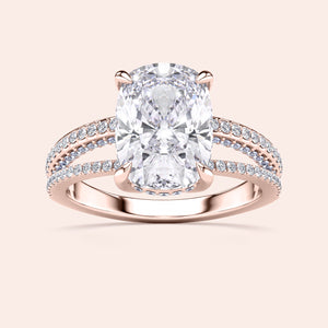 Rose gold split shank engagement ring with cushion cut diamond andPave accents, available in 14K, 18K gold, or platinum.