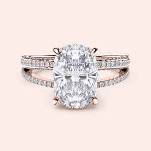 Elegant 14K and 18K rose gold engagement ring featuring a cushion-cut diamond in a split shank design withPave accents.