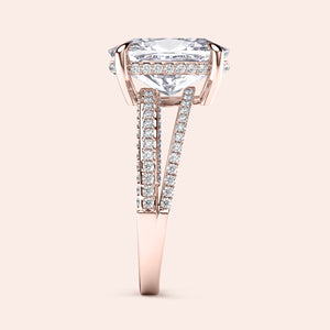 Elegant rose gold engagement ring featuring a radiant cushion diamond and split shank band adorned with round diamonds.