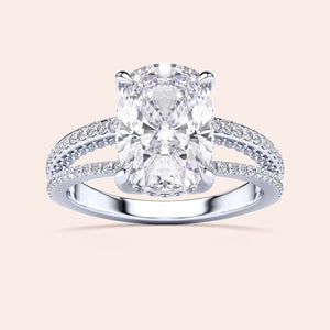 Exquisite 14K White Gold cushion-cut diamond ring with split shank design, adorned with pave-set diamonds.