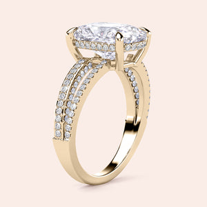 Elegant yellow gold 14K engagement ring featuring a cushion hidden halo and split shank design with pave diamonds.
