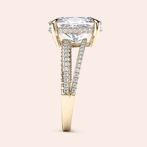 Luxurious 14K yellow gold engagement ring with a cushion-cut diamond and pave-set diamonds on a split shank band.