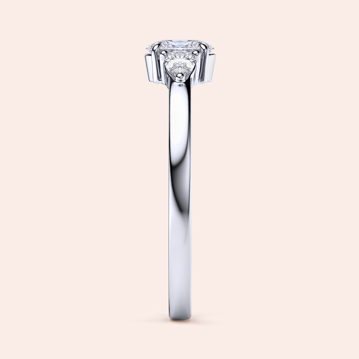Elegant 14K white gold engagement ring featuring an oval diamond center and two pear-shaped side stones in a three-stone setting.