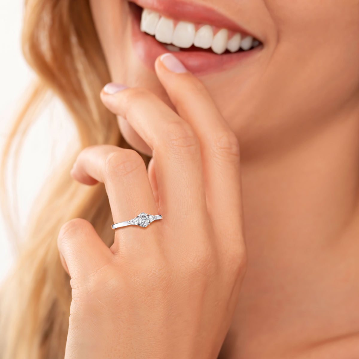 "14K White Gold Oval Small Three Stone Engagement Ring with Pear Side Stones â€“ Elegant and Timeless Design"