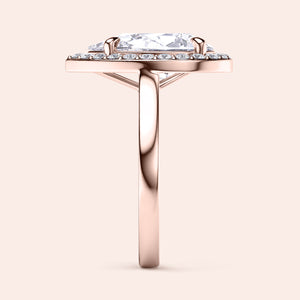 Rose gold teardrop halo engagement ring set featuring pear-shaped diamond, with options in 14K, 18K, or platinum settings.