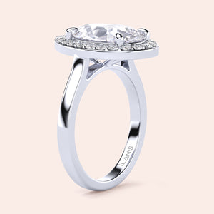 Exquisite pear-shaped diamond engagement ring with halo setting in 14K white gold, showcasing dazzling brilliance.