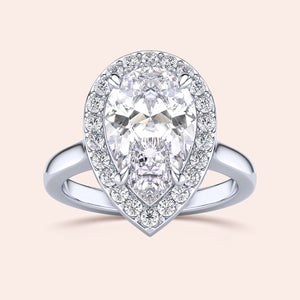 Exquisite pear-shaped diamond engagement ring with halo setting in 14K white gold, showcasing dazzling brilliance.