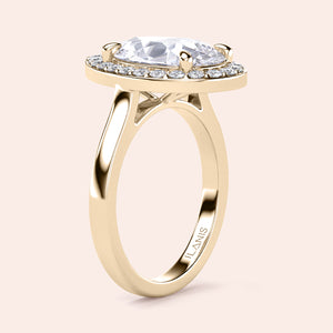 Elegant pear-shaped diamond engagement ring set in 14K or 18K gold, featuring a brilliant halo of smaller diamonds.