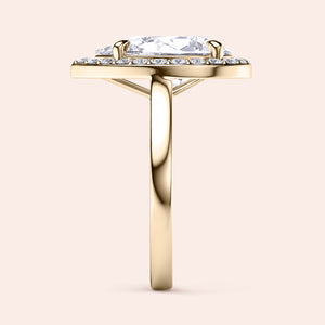Elegant pear-shaped diamond engagement ring set in 14K or 18K gold, featuring a brilliant halo of smaller diamonds.