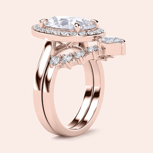 Elegant 14K rose gold engagement ring with a pear halo, featuring a diamond centerpiece and round-cut accents. Not worn on model.