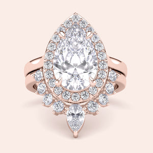 Exquisite pear-shaped diamond engagement ring with halo in 14K or 18K rose gold, showcasing elegance and luxury.
