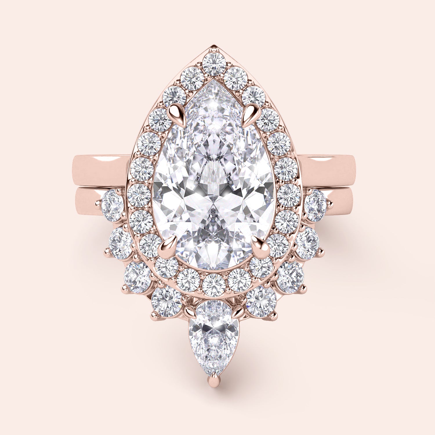 Rose gold teardrop halo engagement ring set featuring pear-shaped diamond, with options in 14K, 18K, or platinum settings.