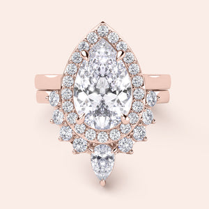 Rose gold teardrop halo engagement ring set featuring pear-shaped diamond, with options in 14K, 18K, or platinum settings.