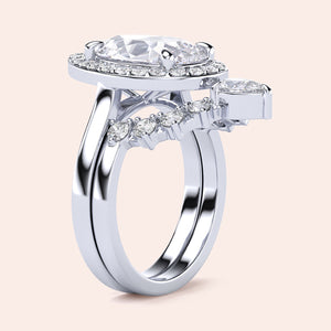Elegant 14K/18K white gold engagement ring with oval-cut diamond center, halo diamonds, and sparkling band for timeless sophistication.