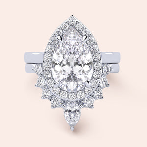 Exquisite pear-shaped diamond engagement ring with halo setting in 14K white gold, showcasing dazzling brilliance.