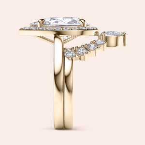 14K/18K yellow gold Amaya two-ring set featuring a pear halo solitaire and plain band, accented with smaller round diamonds.