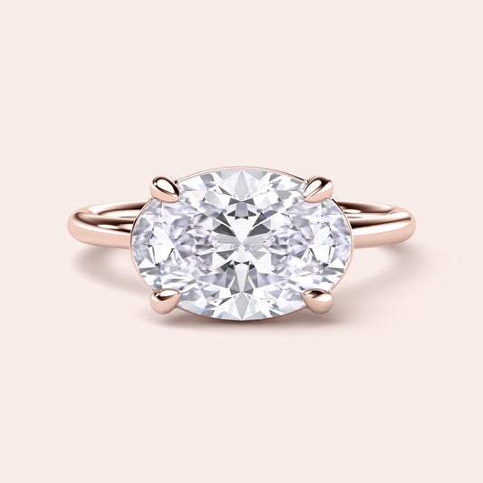 Stunning oval diamond engagement ring in 14K or 18K rose gold, featuring a brilliant-cut diamond. Perfect for proposals.