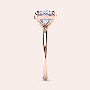 Rose gold engagement ring with round-cut diamond, showcasing intricate prong setting, available in 14K, 18K, or platinum.