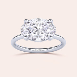 Elegant oval diamond solitaire ring in 14K or 18K white gold, featuring a classic 4-prong setting for timeless beauty.