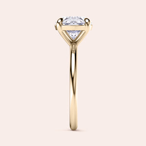 Elegant 14K and 18K yellow gold oval east-west solitaire engagement ring featuring a stunning round brilliant-cut diamond.